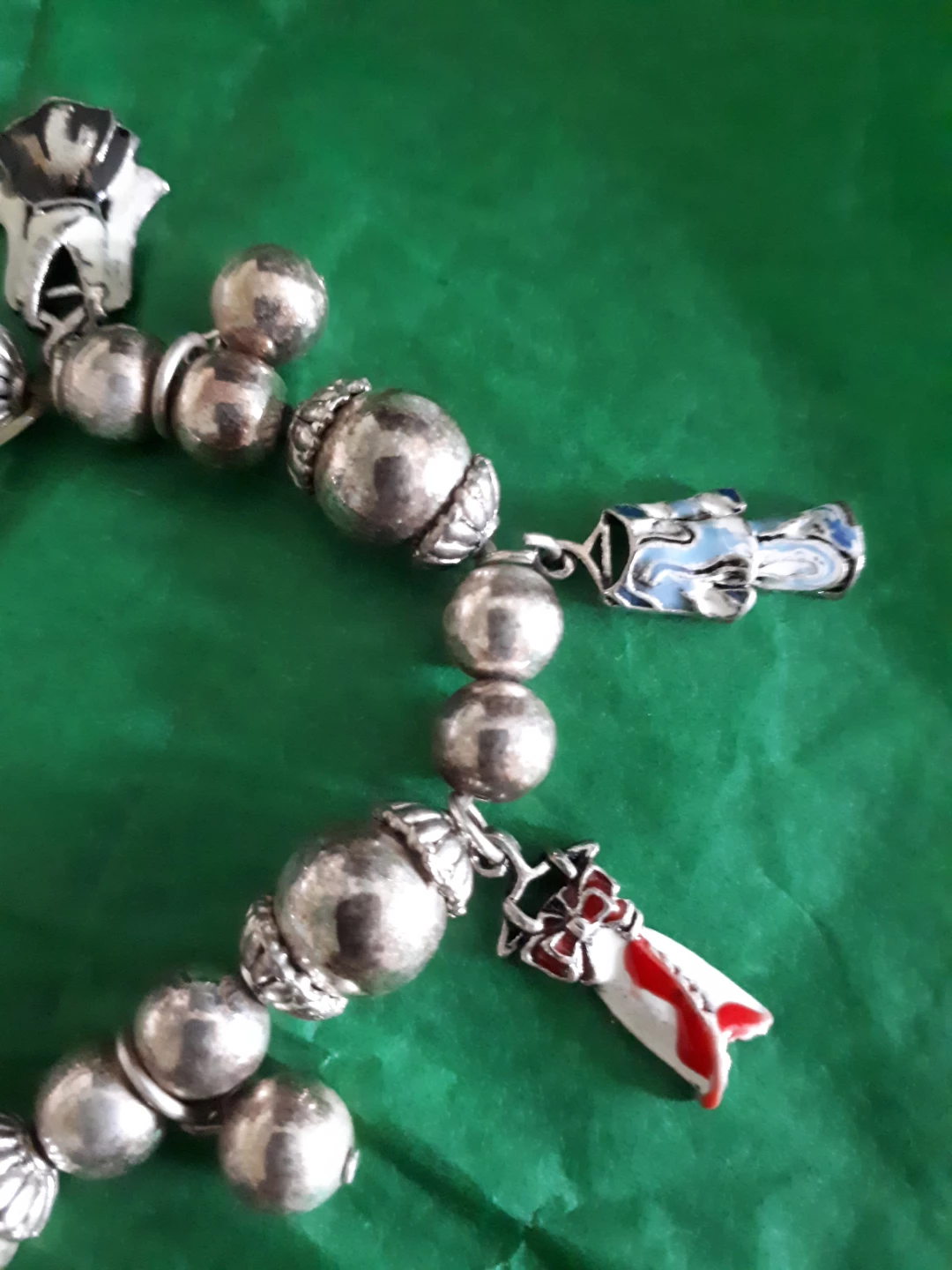 Silver-tone charm bracelet with various charms - photo 2