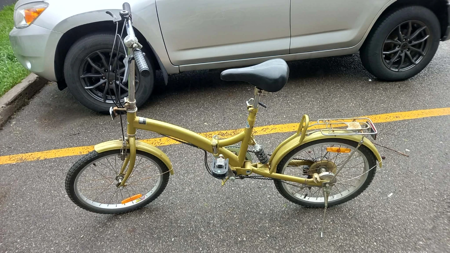 Gold folding bicycle with rear rack