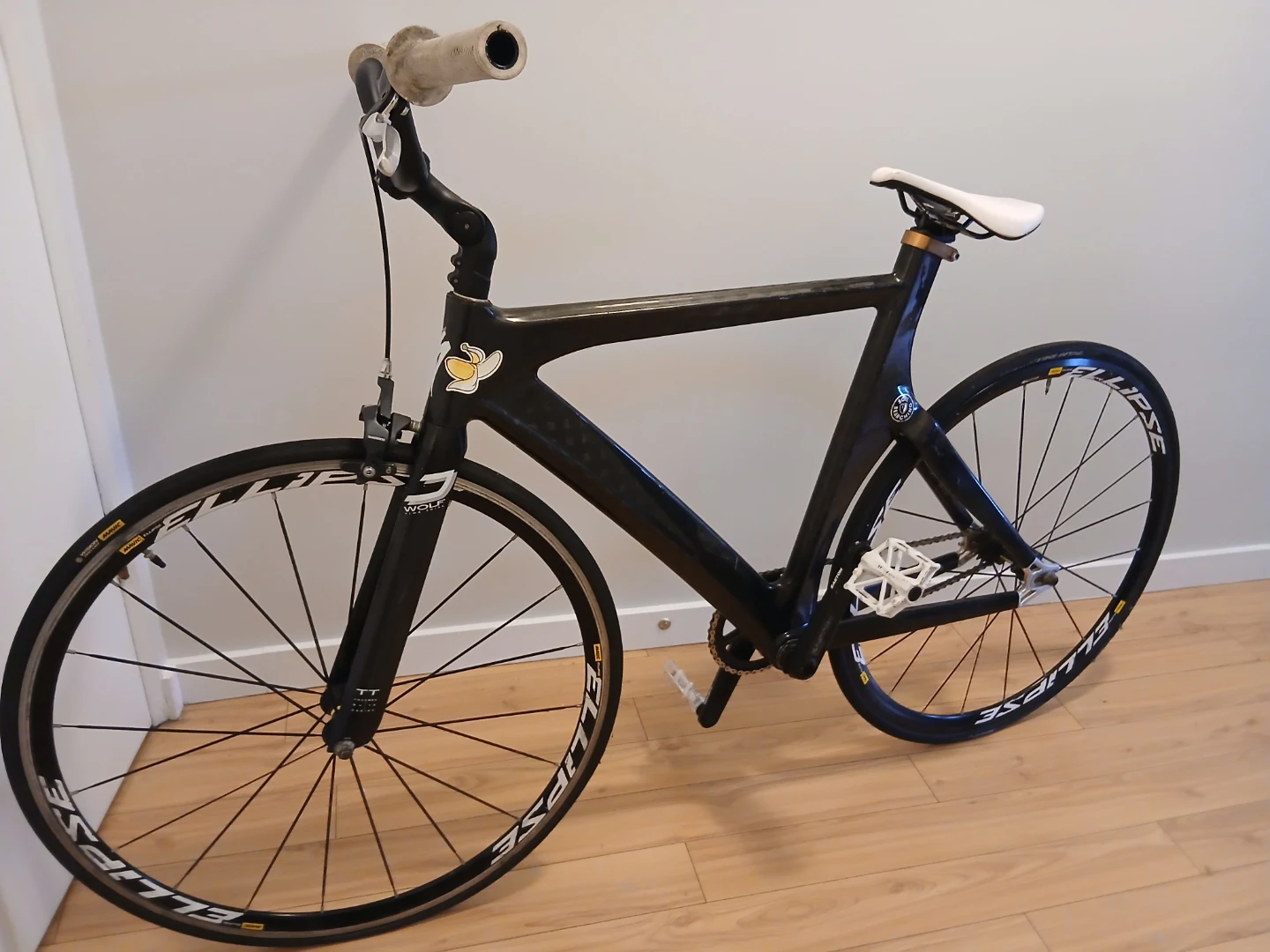 Black carbon fiber track bike with Mavic Ellipse wheels