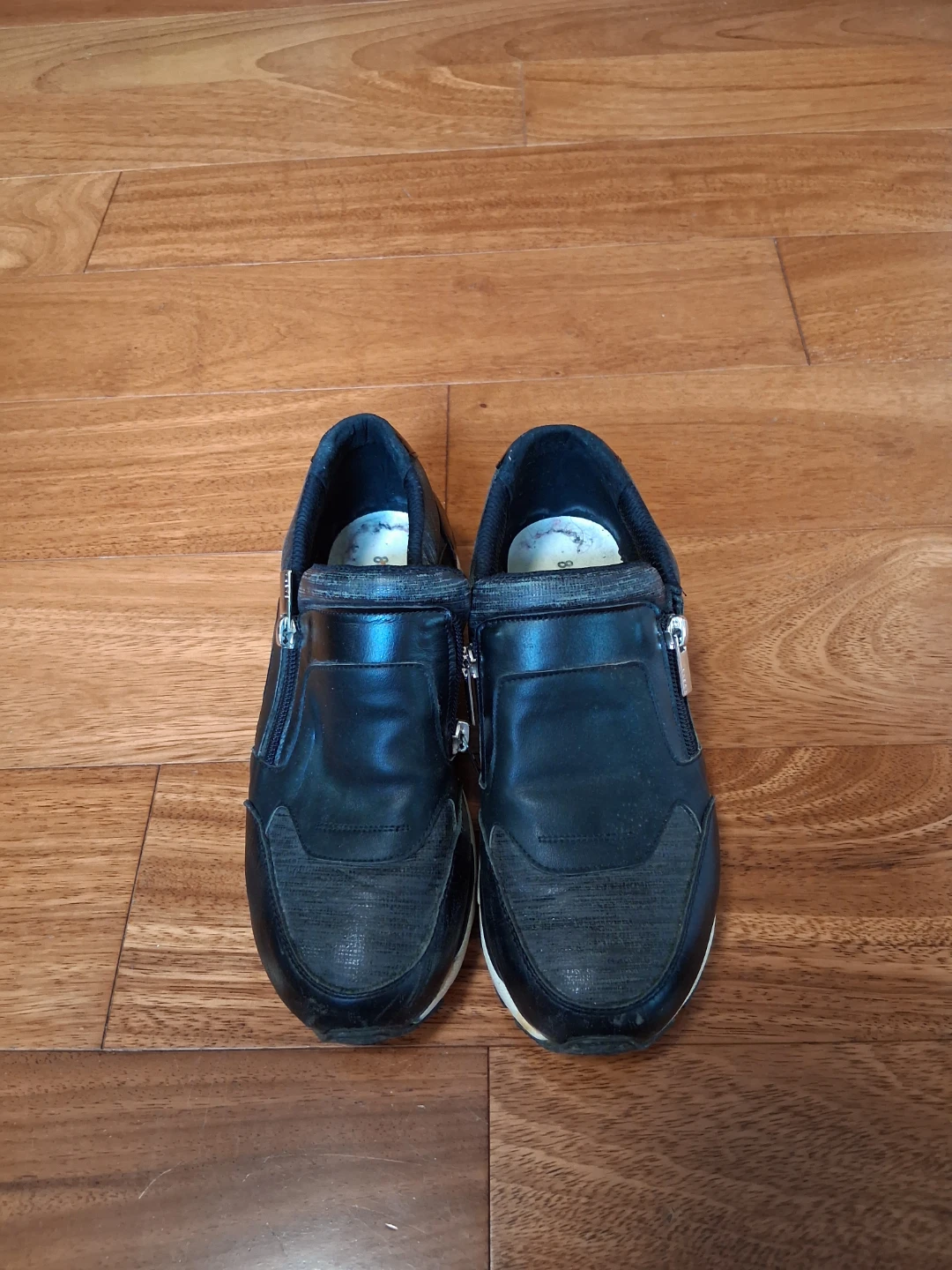 Black zippered slip-on sneakers