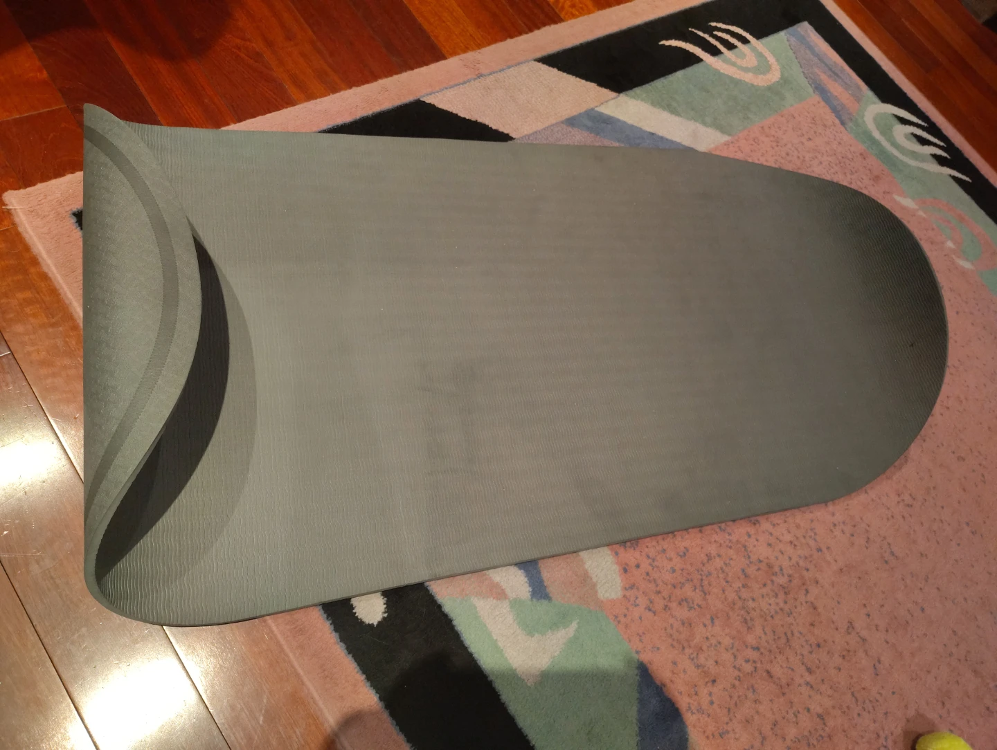 Rolled up dark grey yoga mat - photo 3
