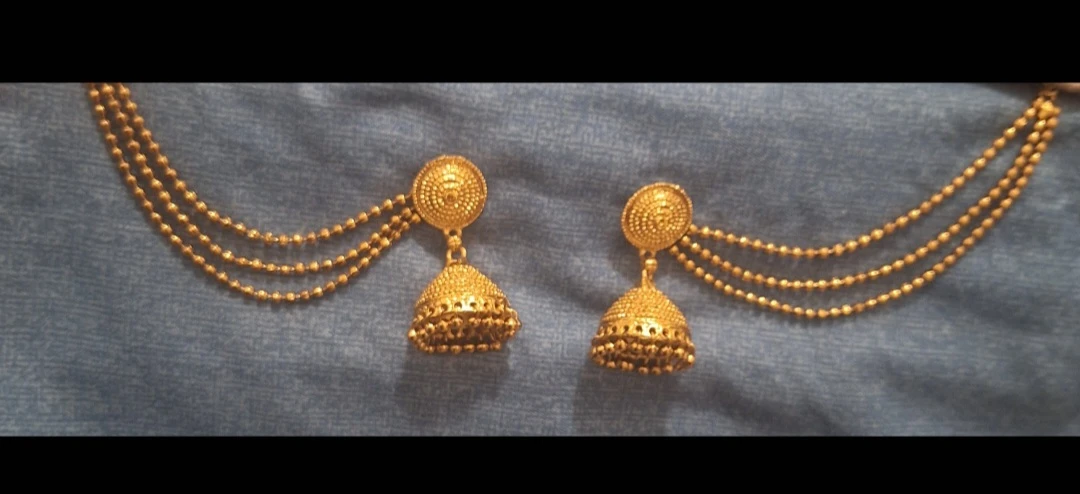 Gold tone Jhumka earrings with triple bead chains
