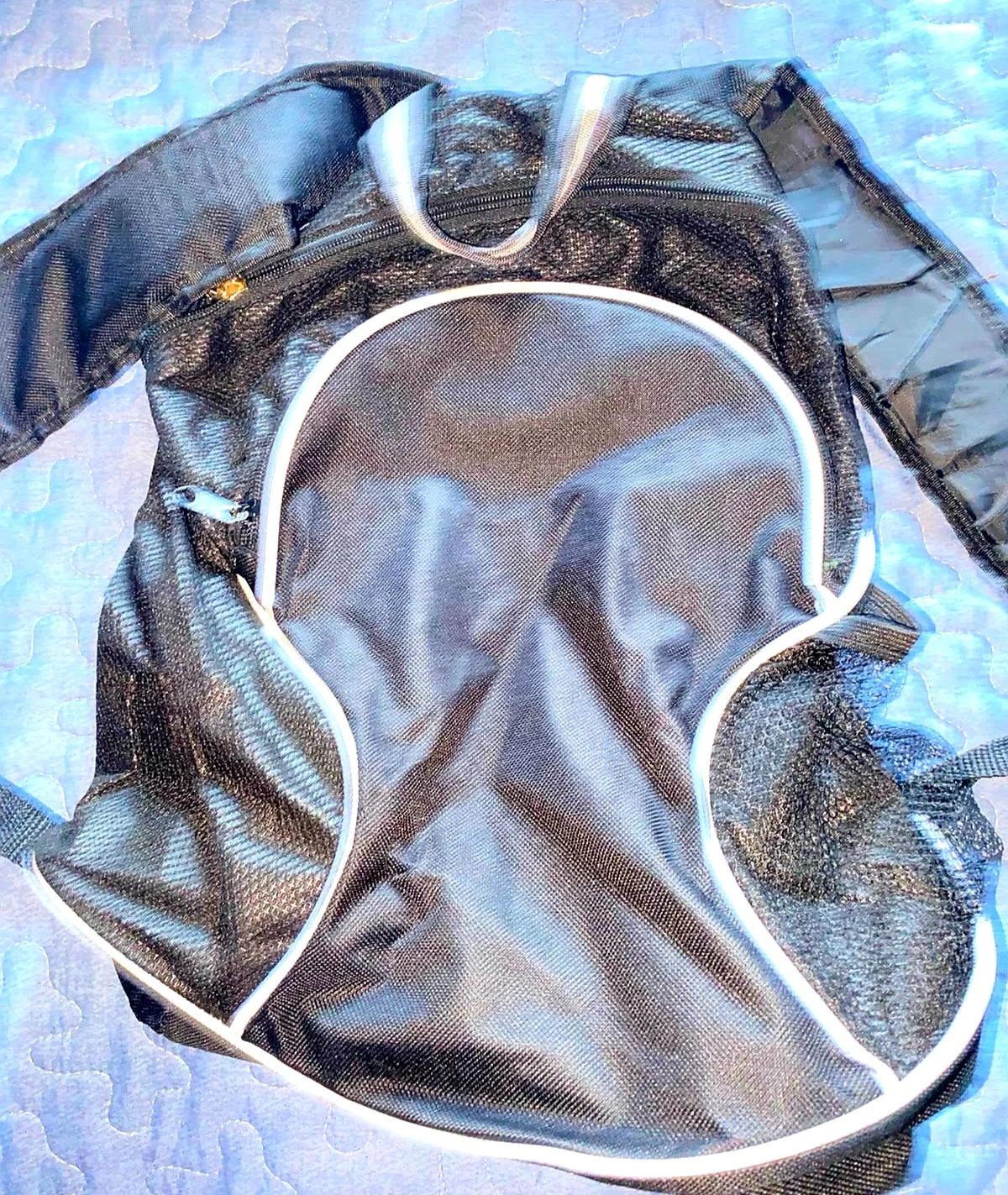Black mesh backpack with white trim