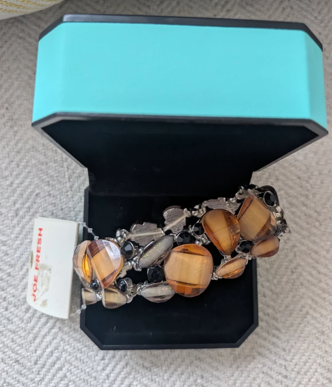 Beaded Bracelet with Amber-Coloured Stones in a blue box