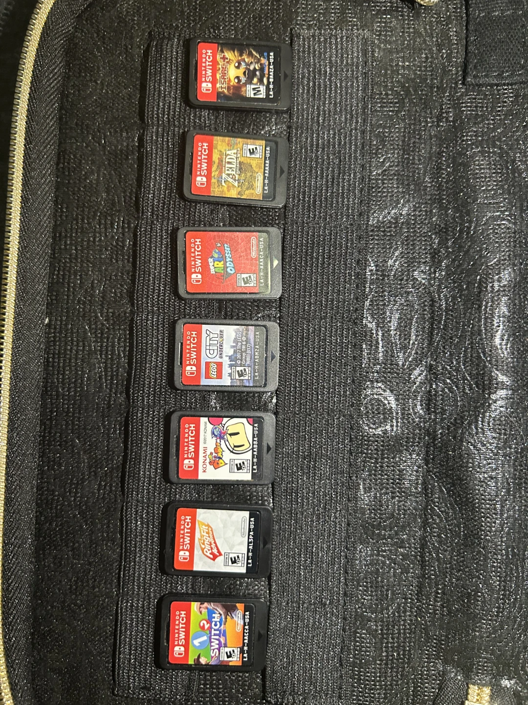 2 Nintendo Switches, 7 games, and case with controllers. - photo 4