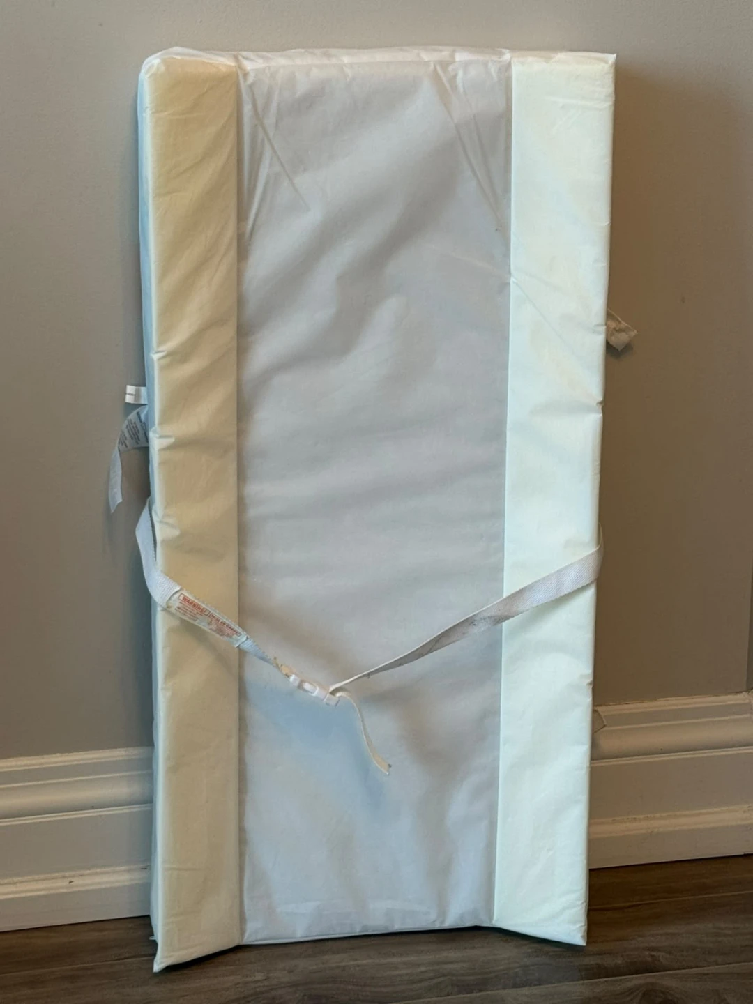 Diaper changing pad with straps