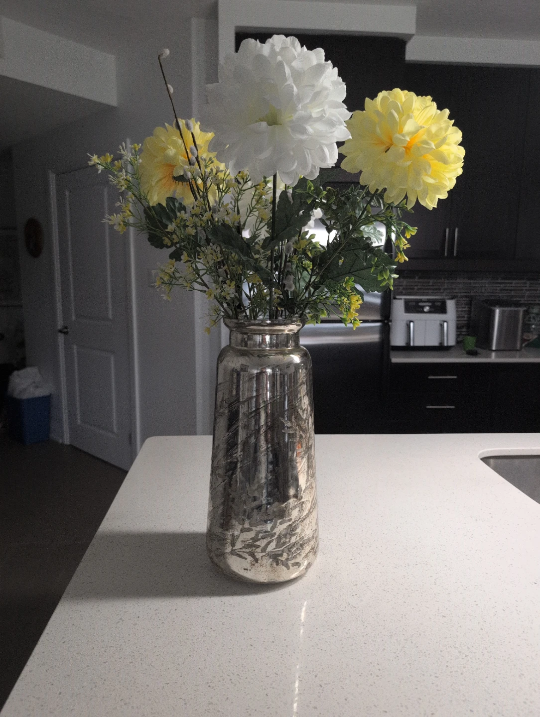Vase with artificial flowers