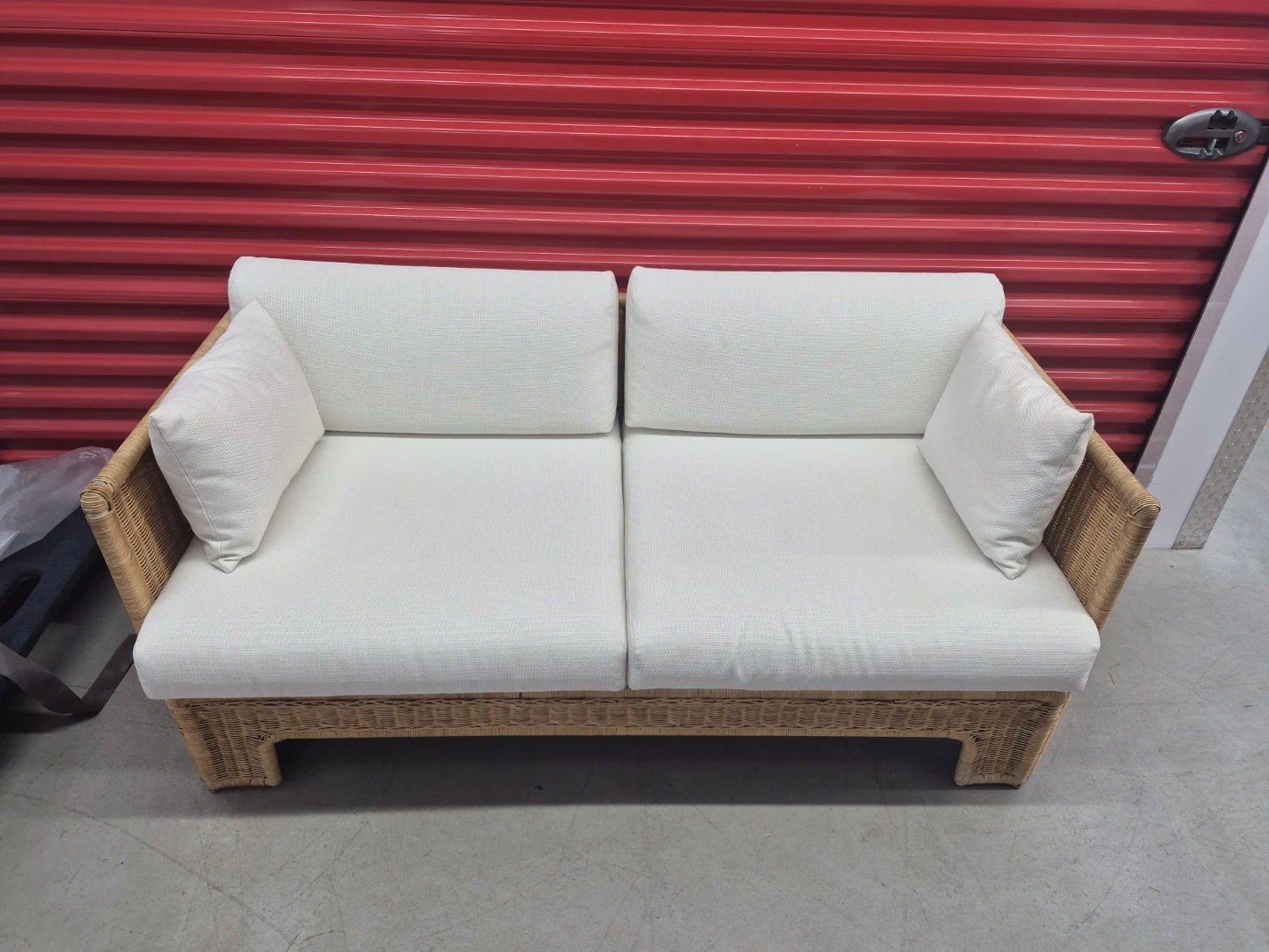 Woven wicker sofa with white cushions - photo 2