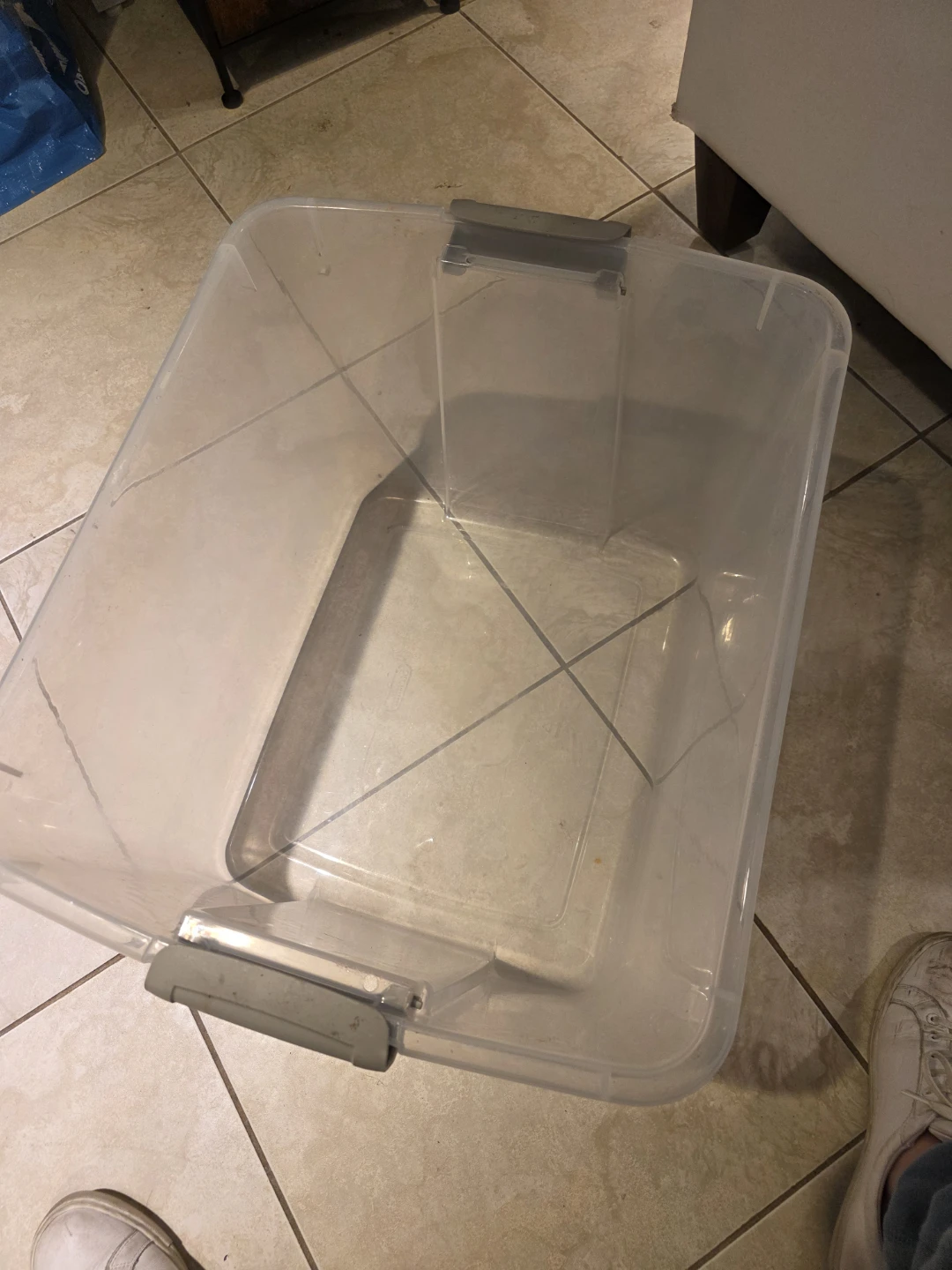 Clear plastic storage bin with grey latches