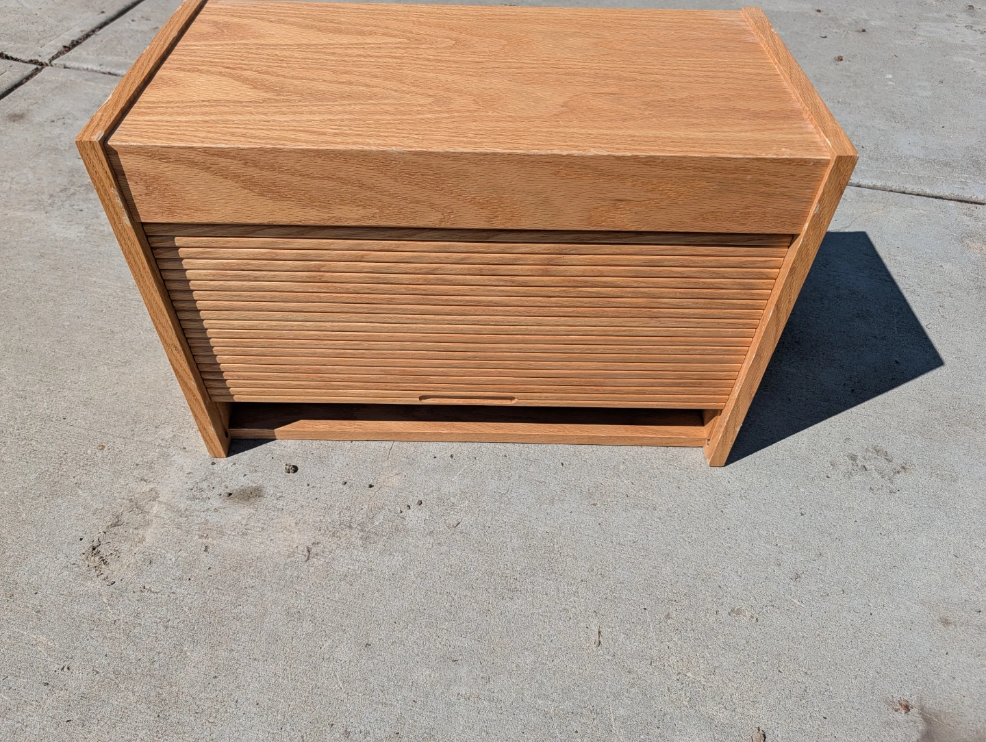 Solid wood box with rolling lid