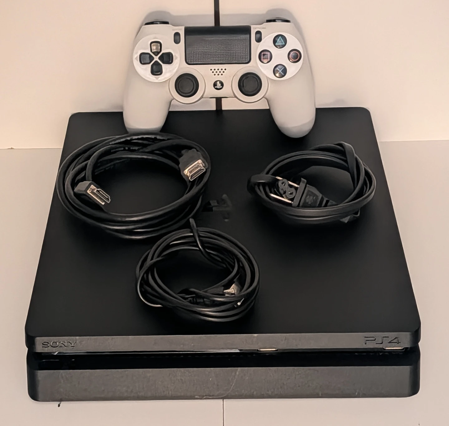 Well-kept 1TB PS4 Slim w/ Controller & Cables - $150