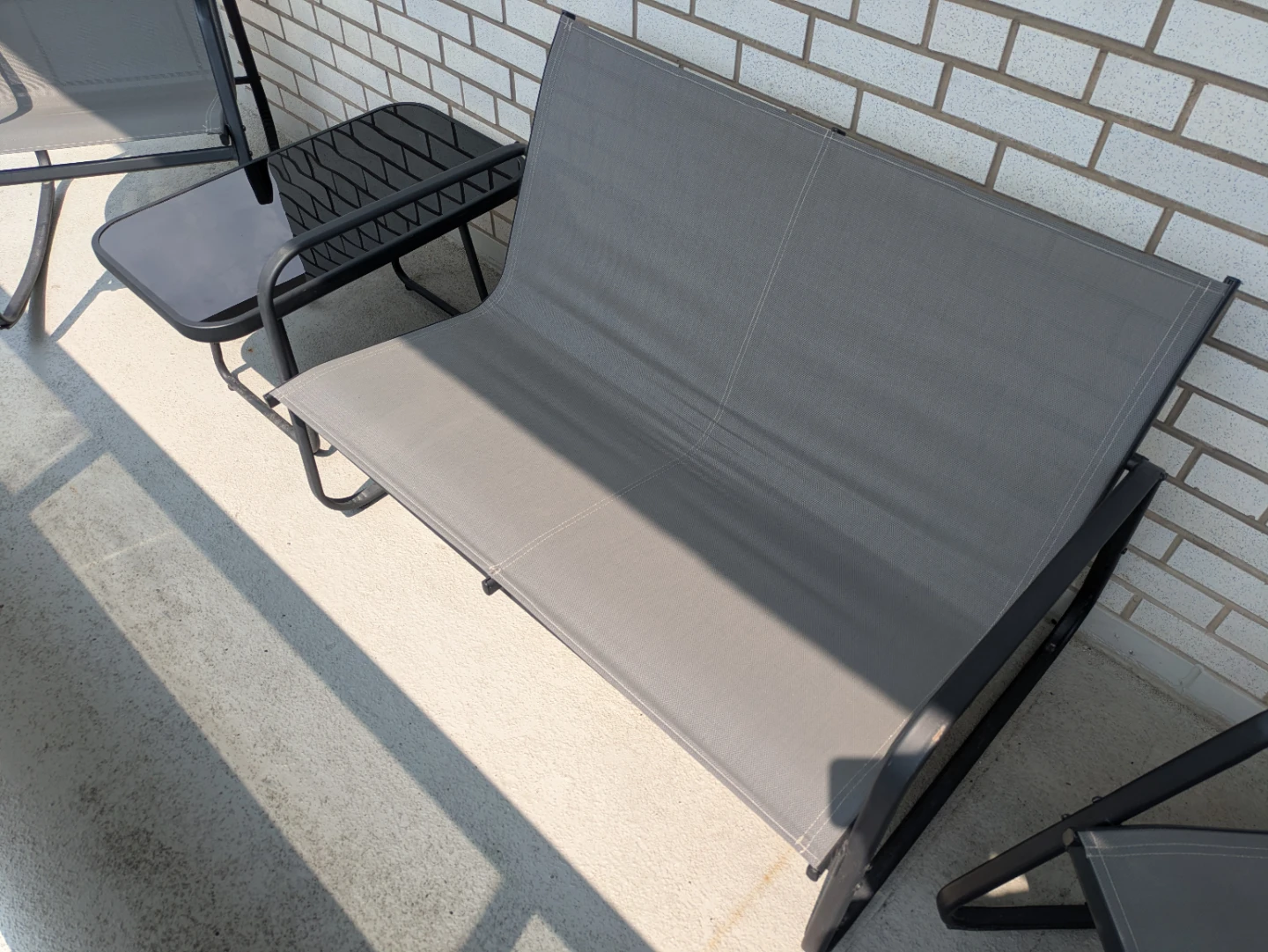 Like-New 4-Piece Patio Rocking Set with Glass Table