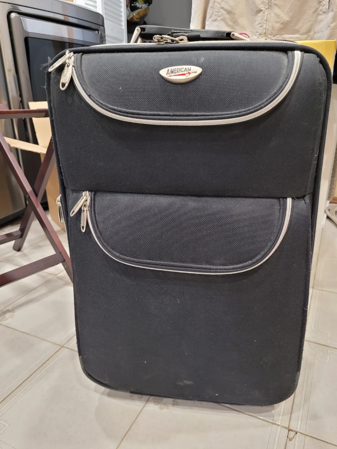American Tourister Rolling Suitcase