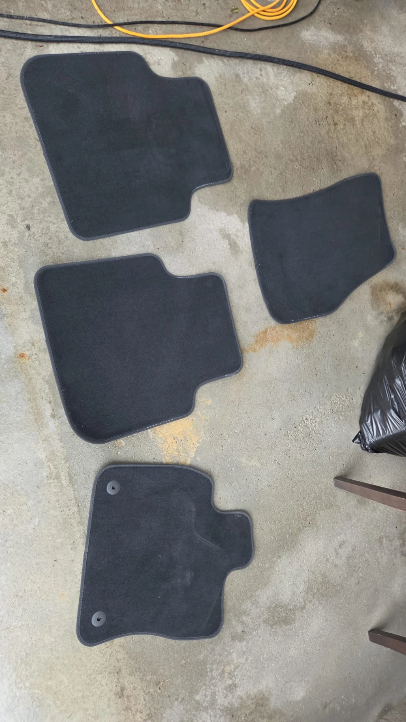 Set of 4 Black carpet floor mats from a 2012 dodge grand caravan