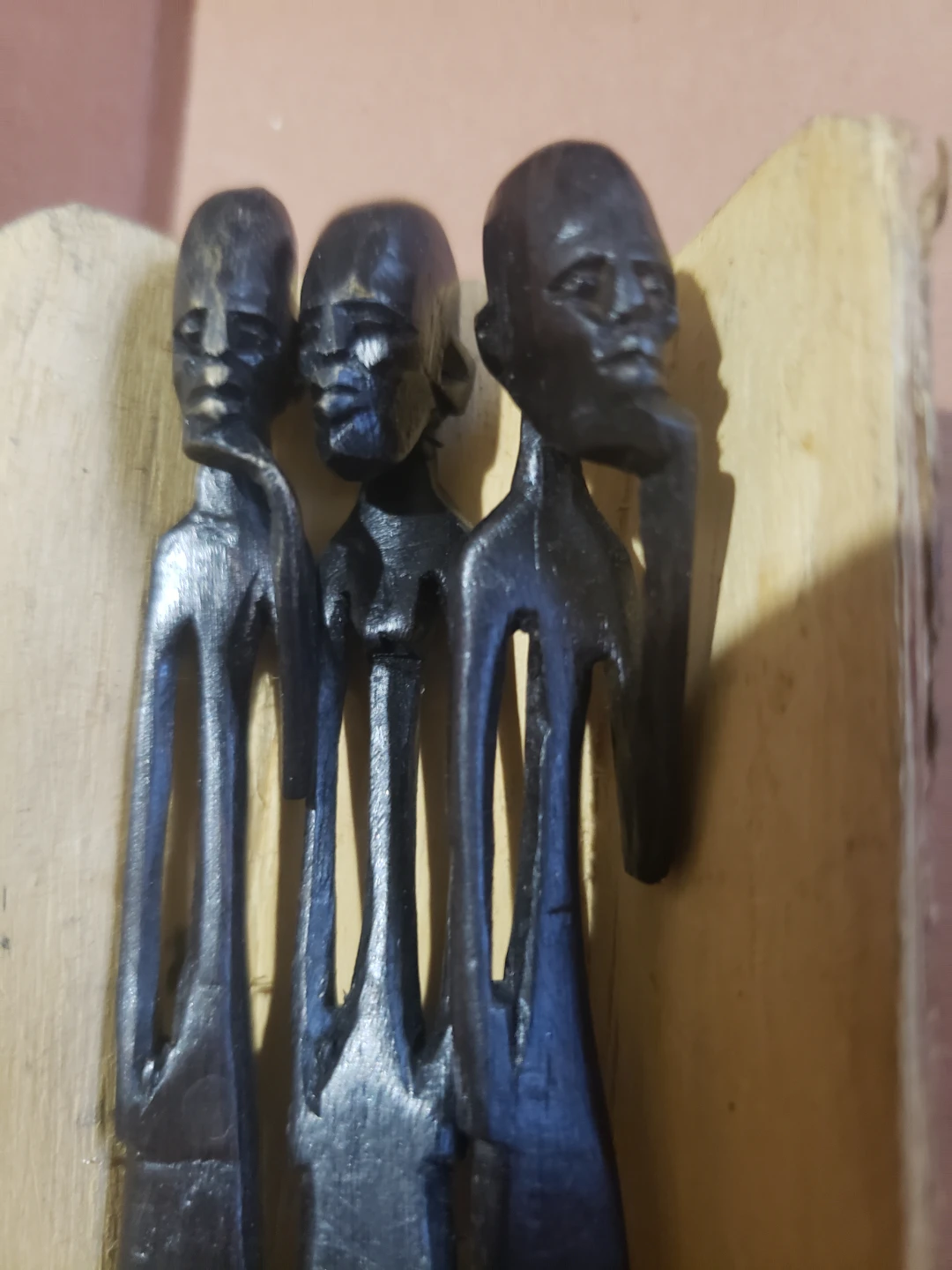 Wooden Carving of Three Figures