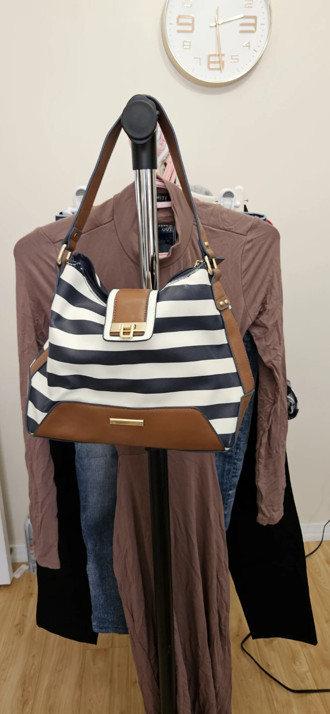 Navy and white striped shoulder bag with tan trim