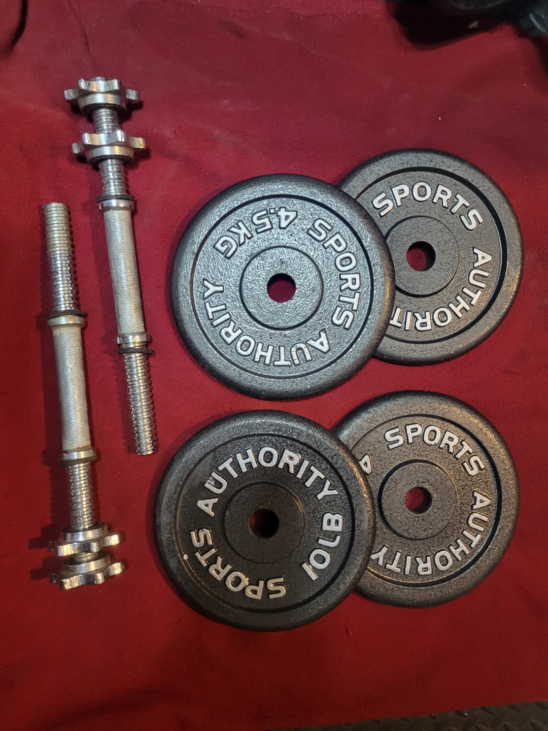 1" HOLE  40LBs WITH DUMBBELL HANDLES. SPORTS AUTHORITY  4-10s