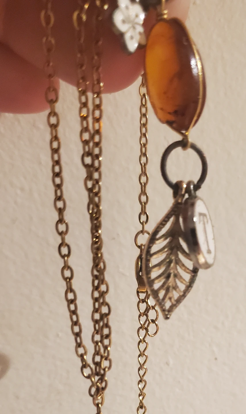 Gold-tone necklace with amber pendant and initial T charm - photo 2
