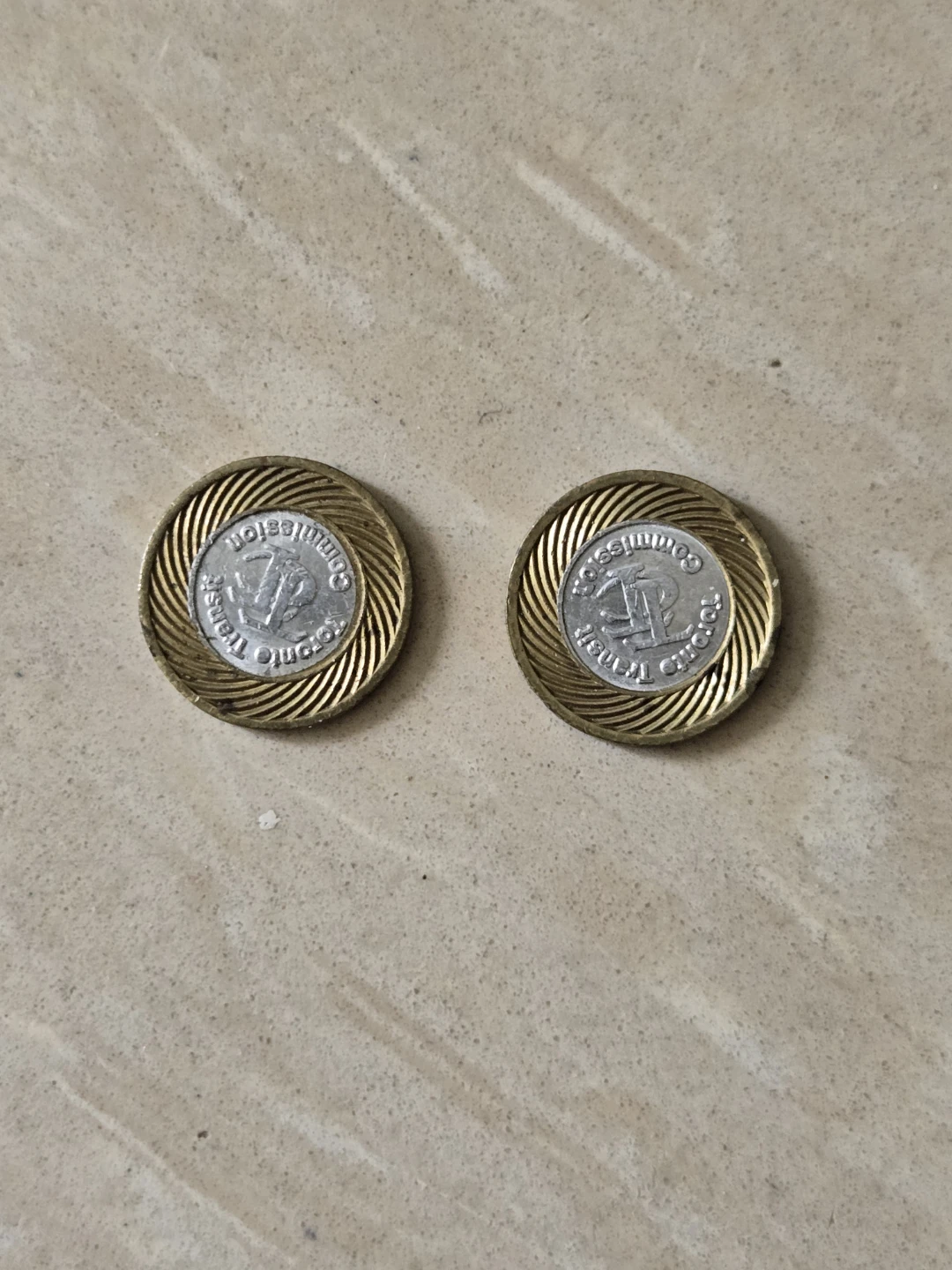 Two TTC Toronto Transit Commission tokens