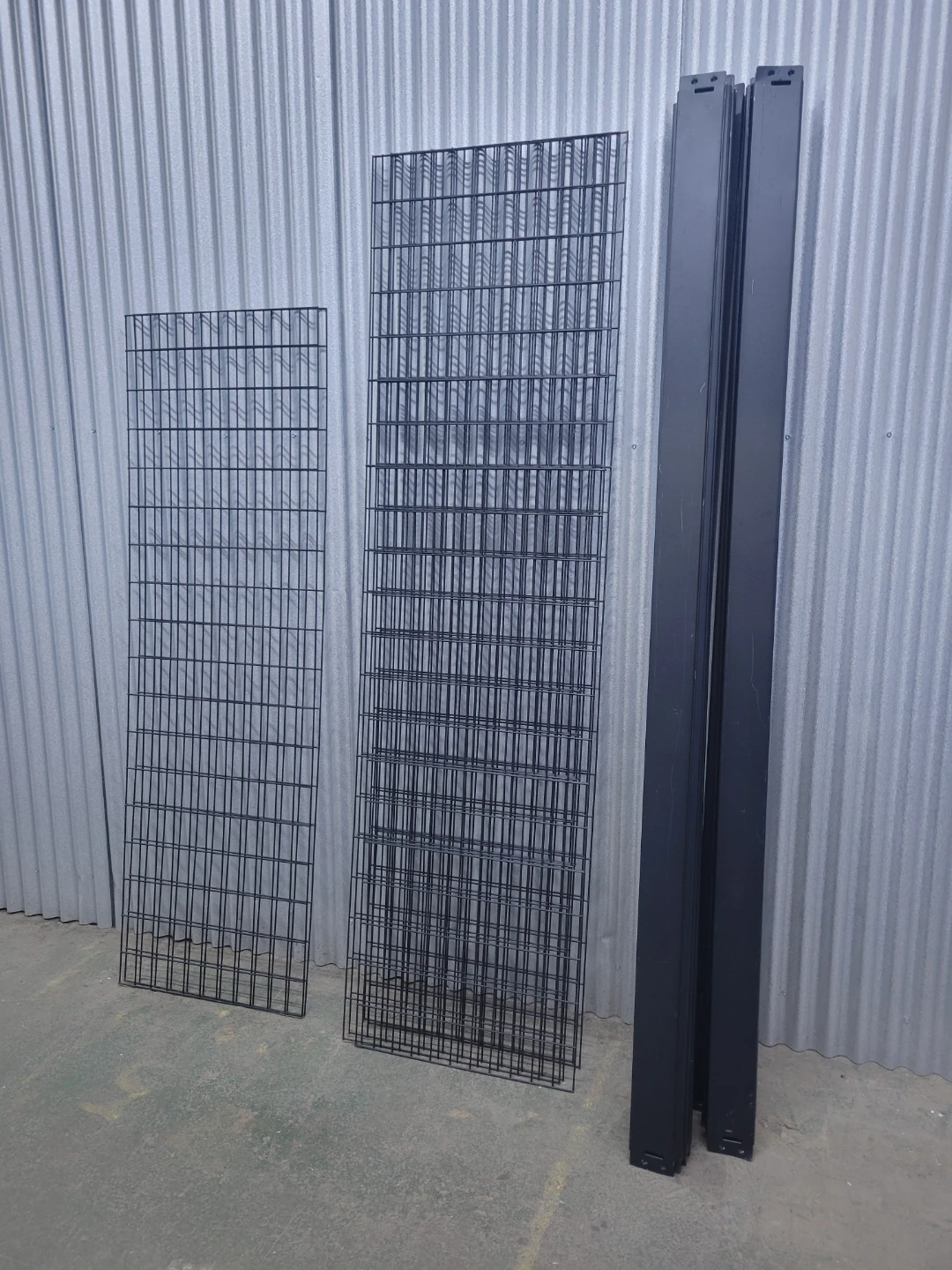 Black Metal Grid Panels and Support Beams