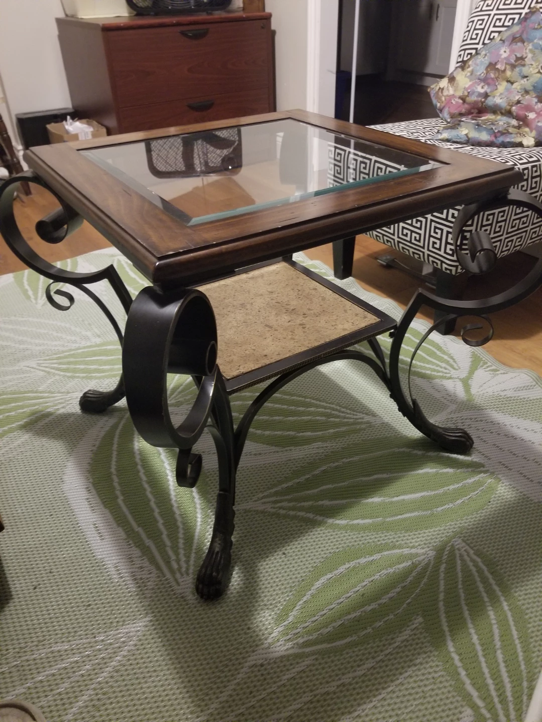 This elegant wrought iron end