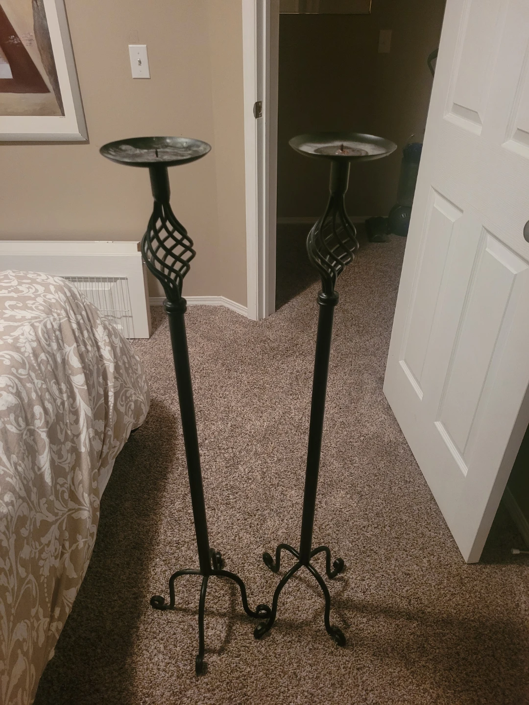 Two metal candle stands.