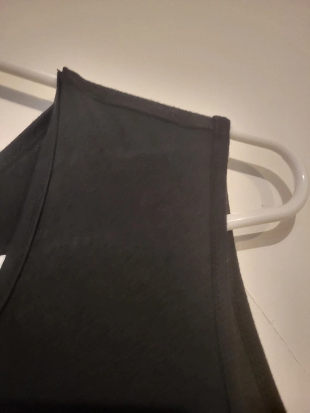 Black sleeveless top with embroidered cross design - photo 4