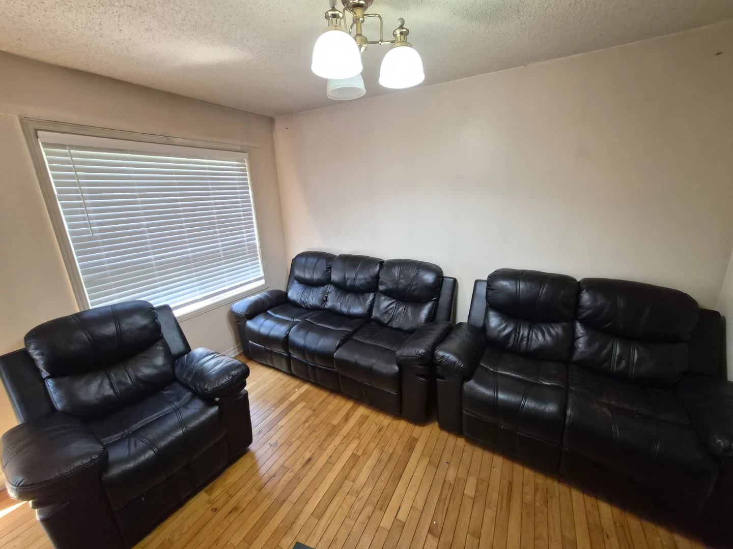 Black Leather Reclining Sofa and Chair Set