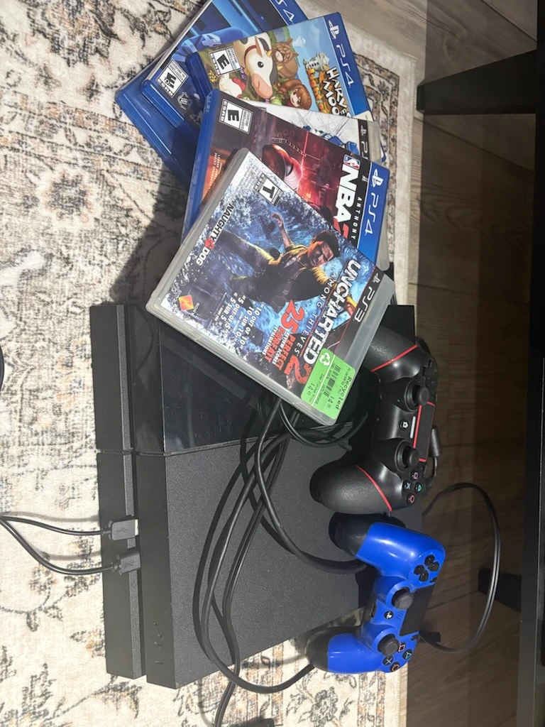 PlayStation 4 Console with Two Controllers and Games