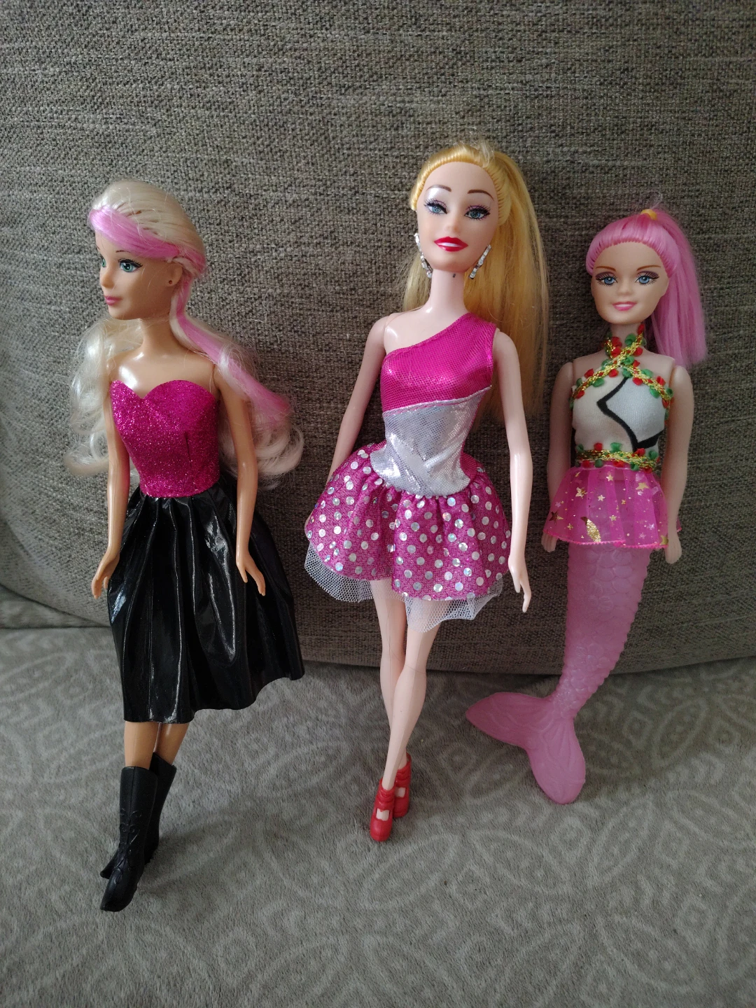 Three fashion dolls