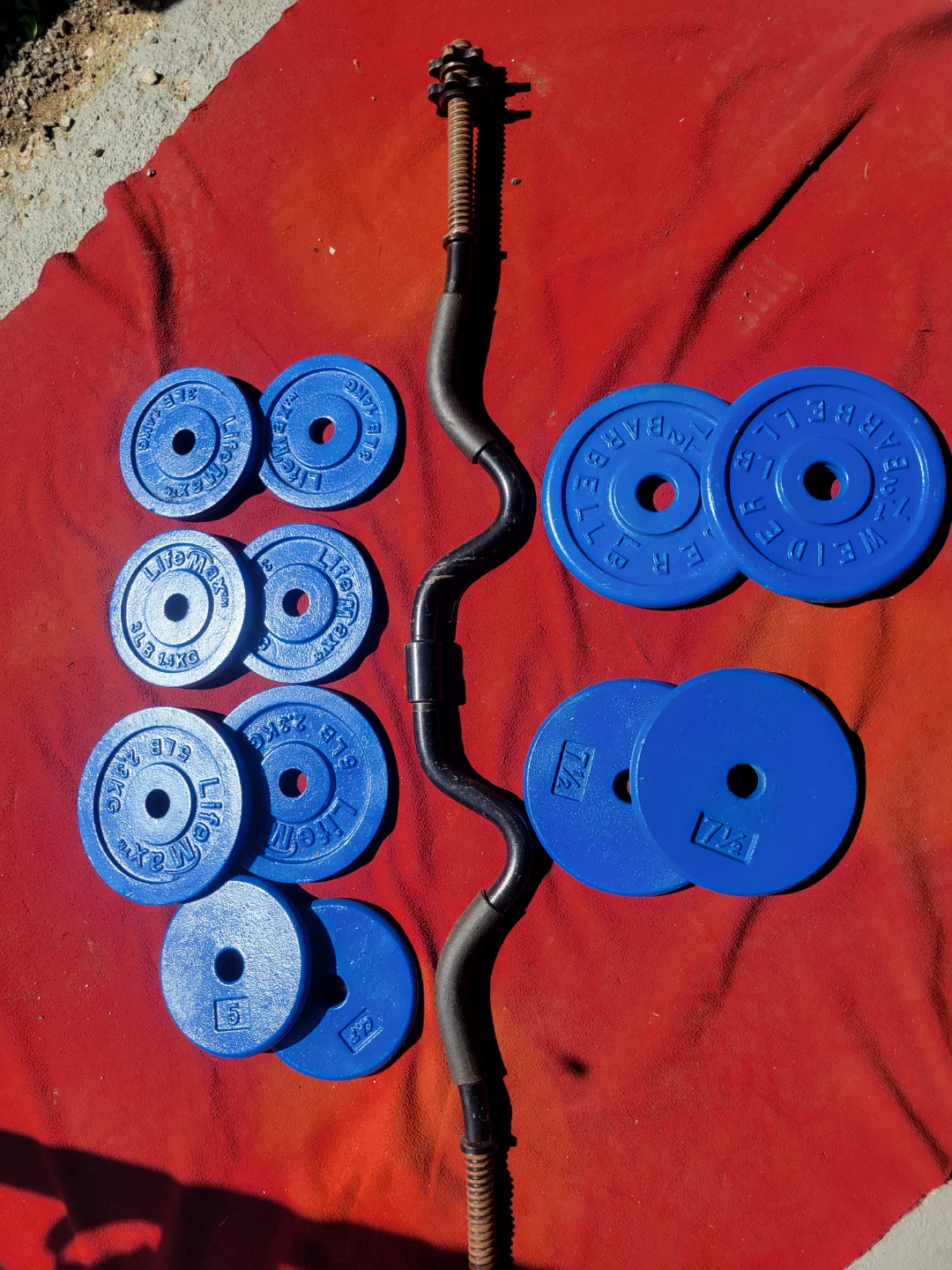 1" HOLE  EZ-CURL BAR AND 62LBs.