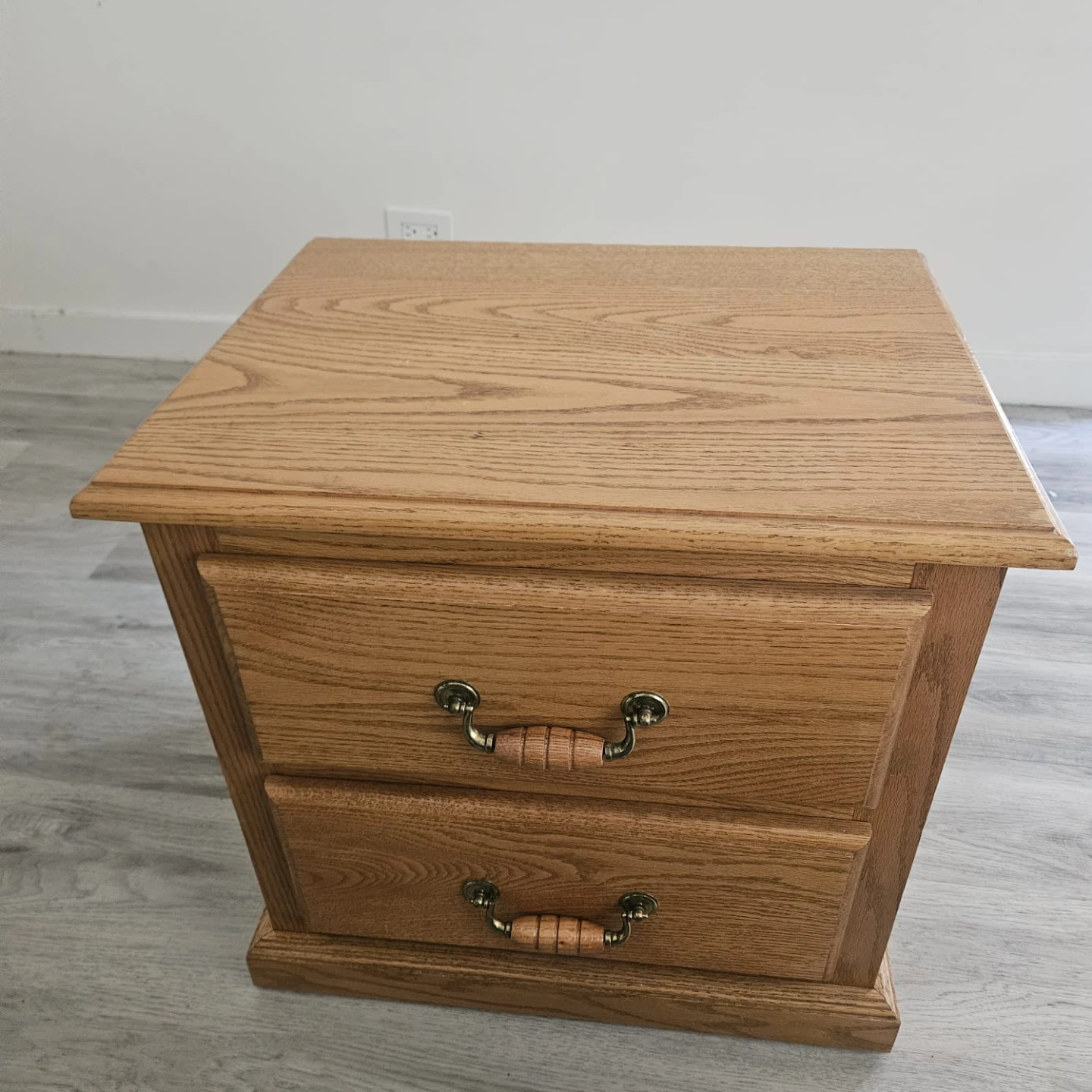 Oak finish nightstand with two drawers
