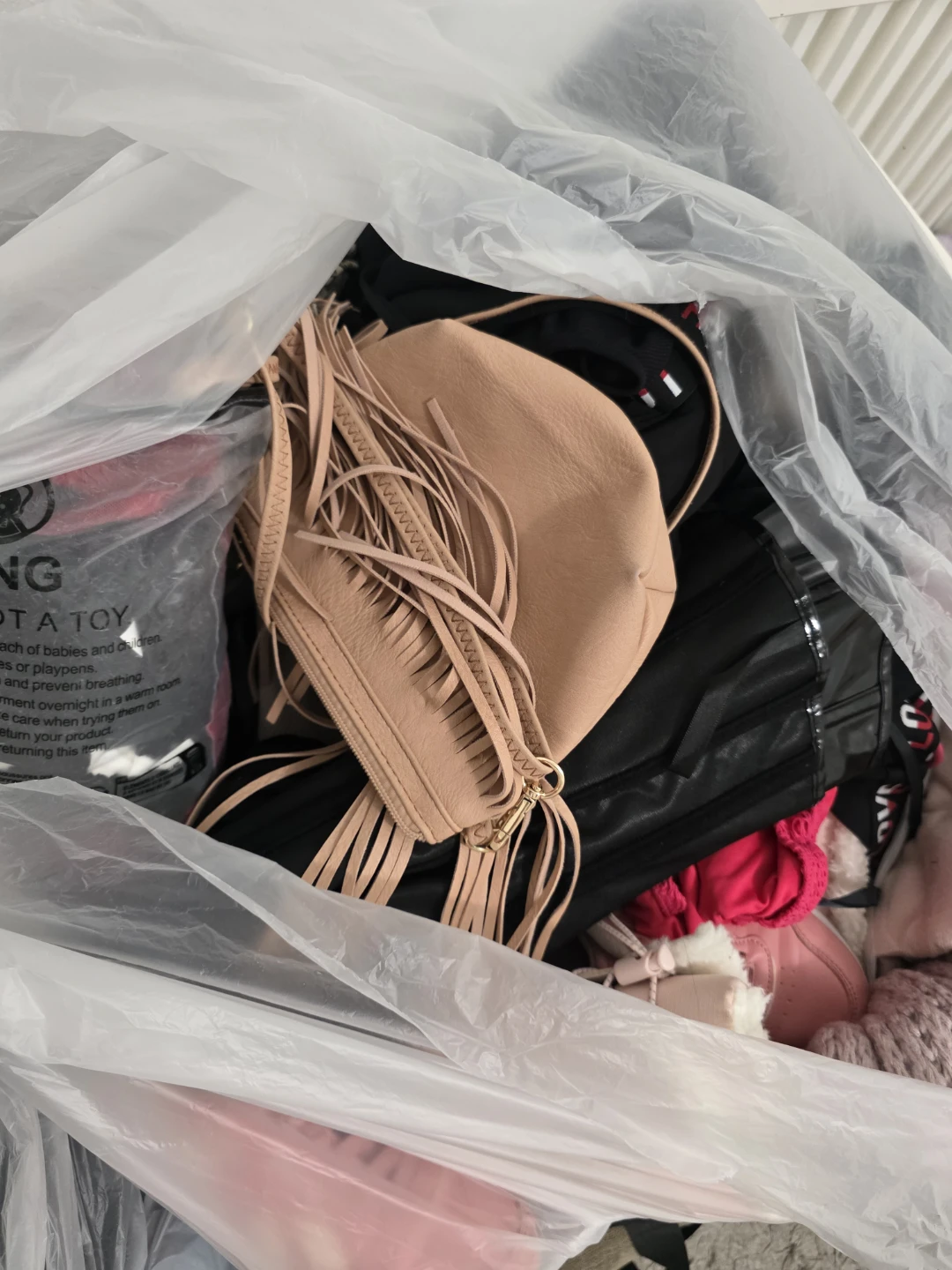 Bag of assorted women's clothing and accessories