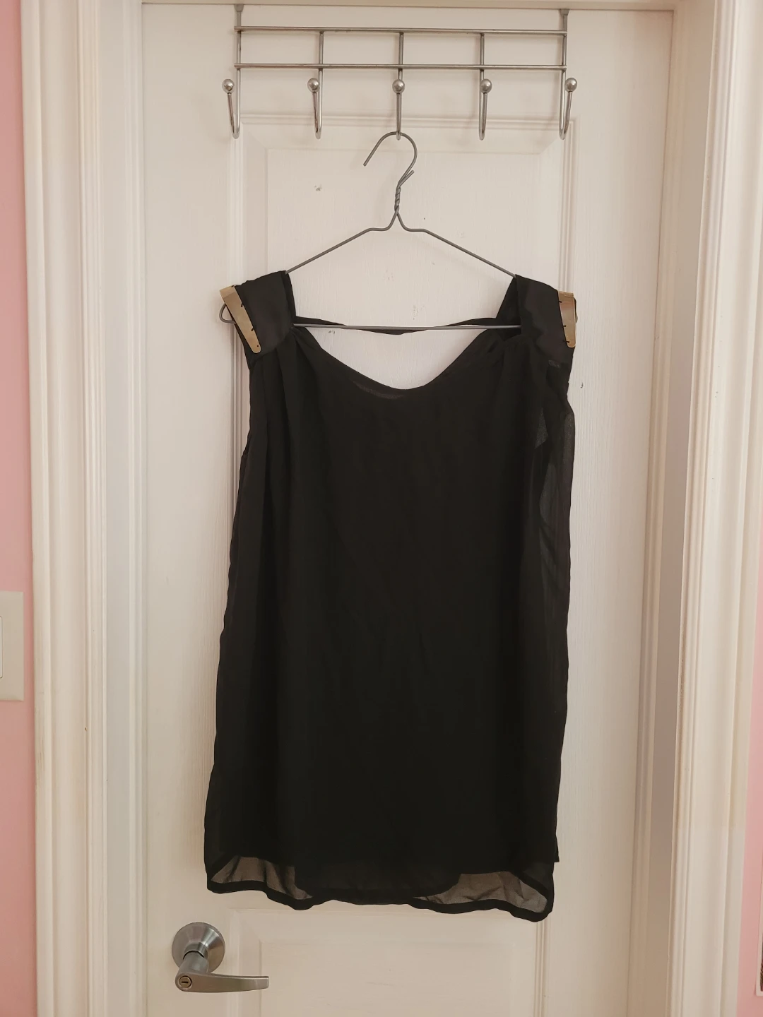 Black sleeveless top with gold accents