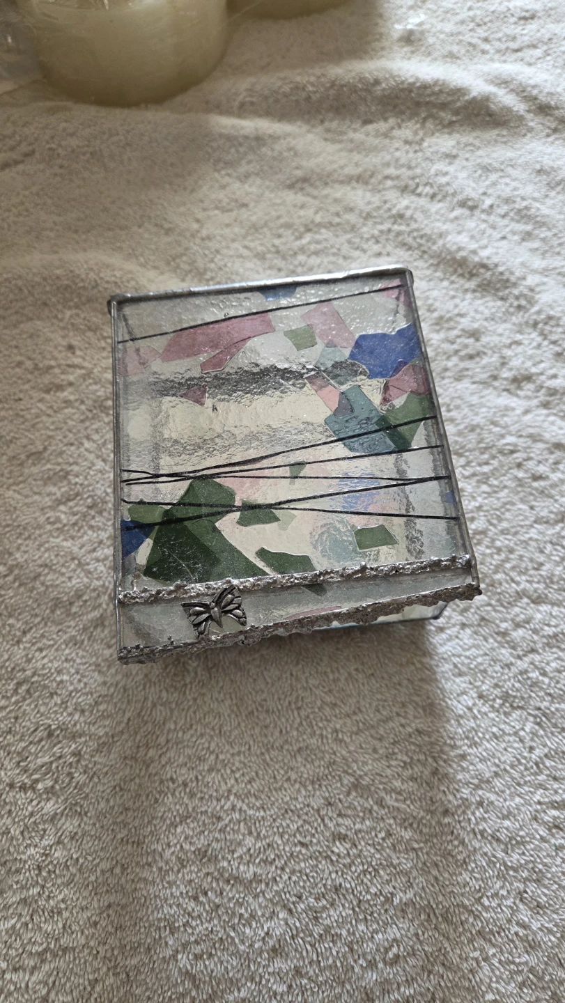 Glass jewelry box with silver and colored decor