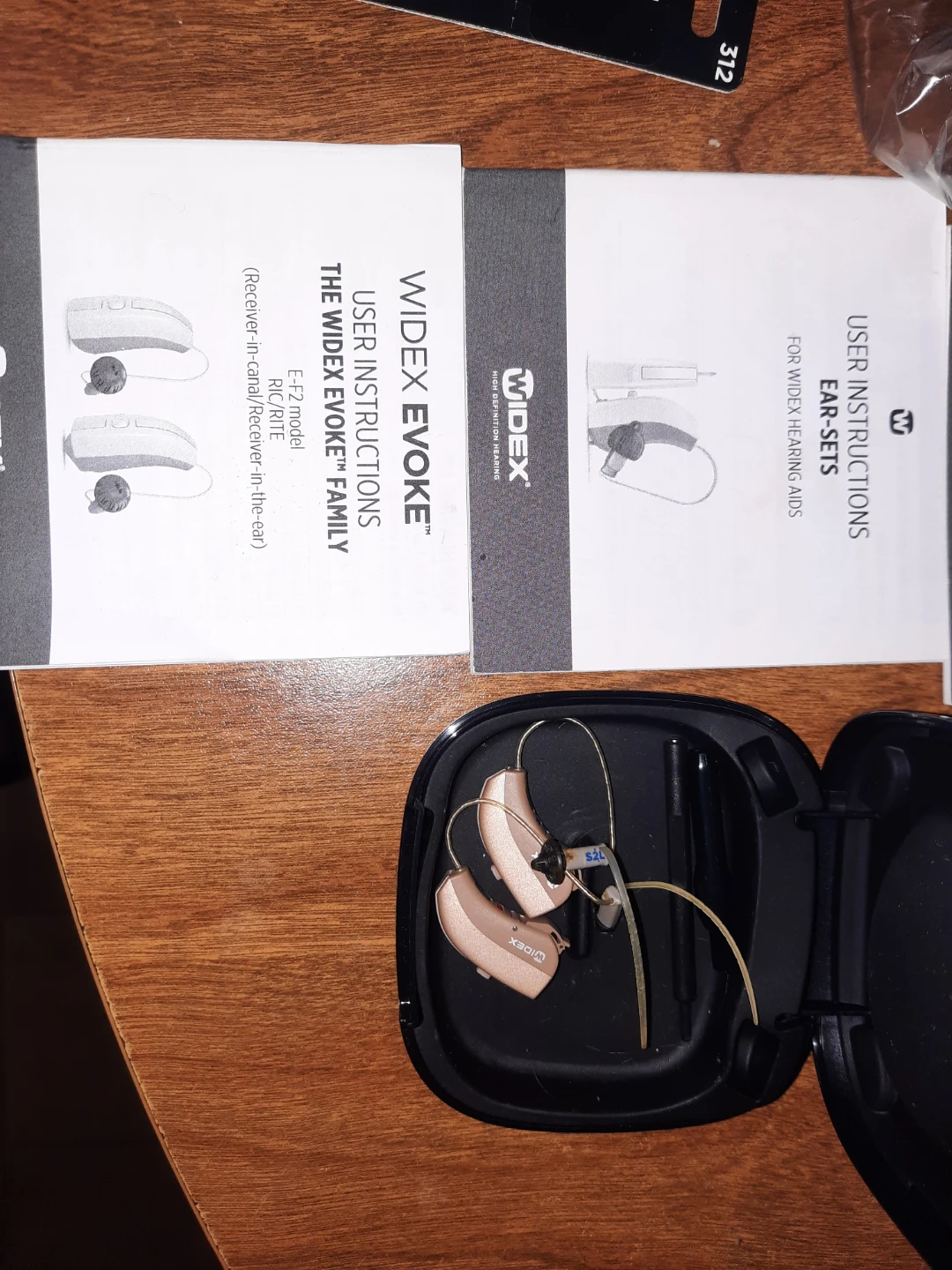 Widex Evoke hearing aids with accessories