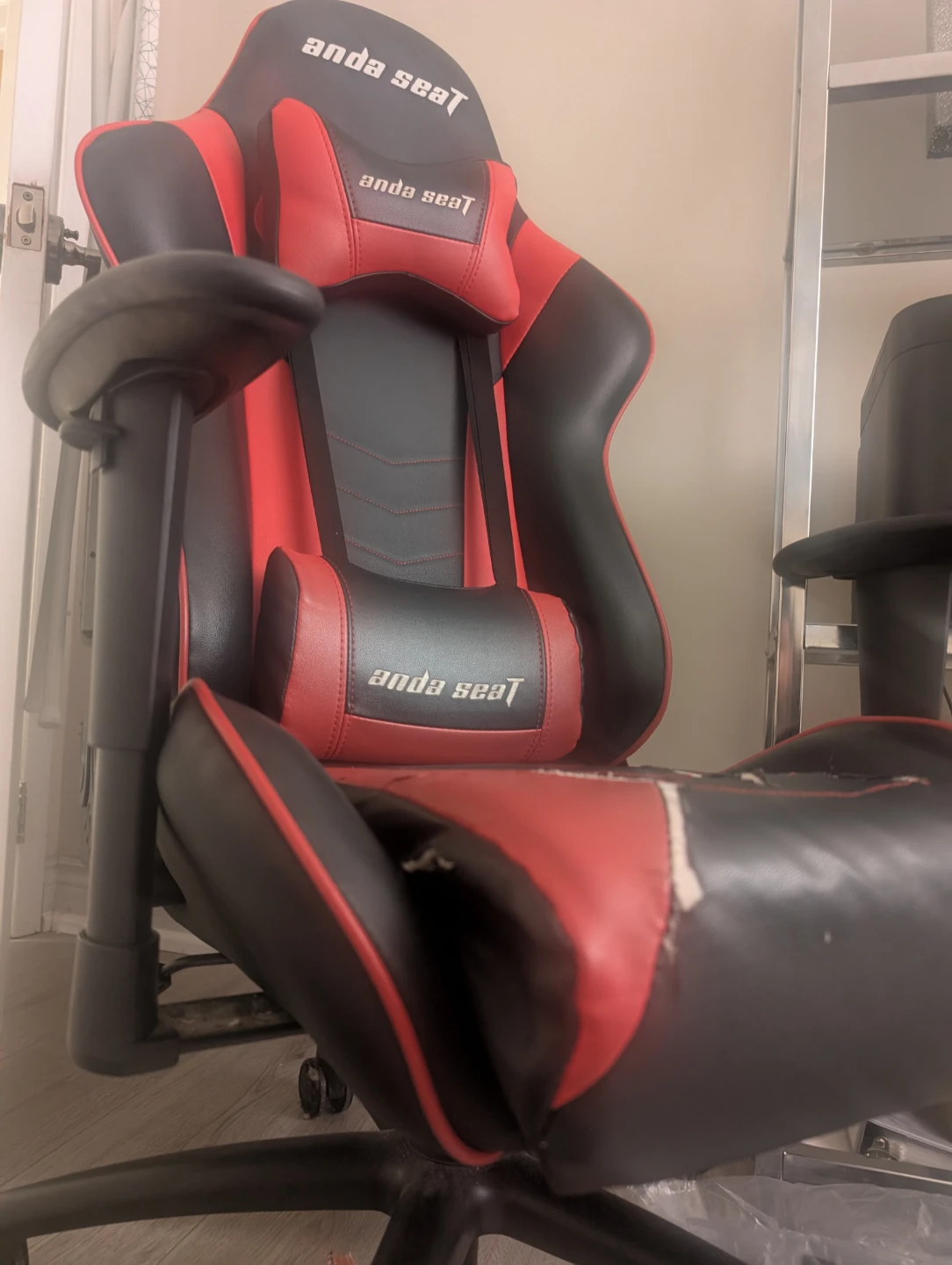 Gamer chair with ripped up seat