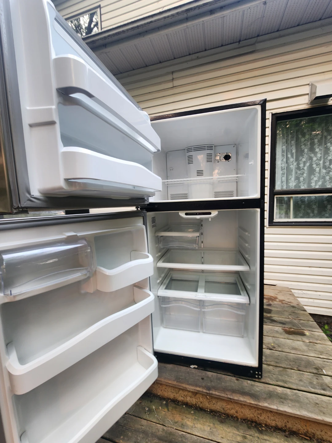 GE Stainless Steel Top Freezer Refrigerator - photo 2