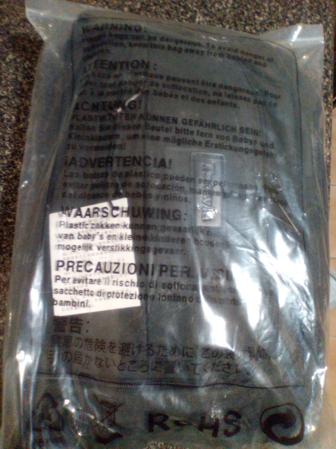 Black Travel Bag with Warning Label