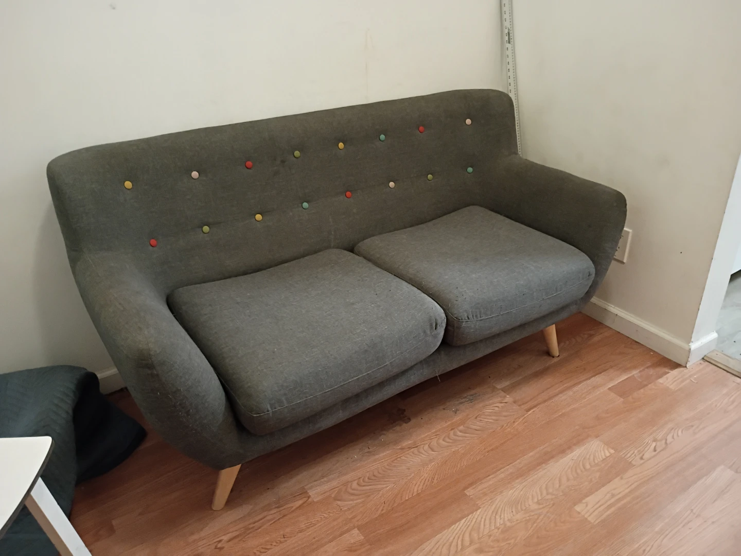 Gray Loveseat with Colorful Buttons