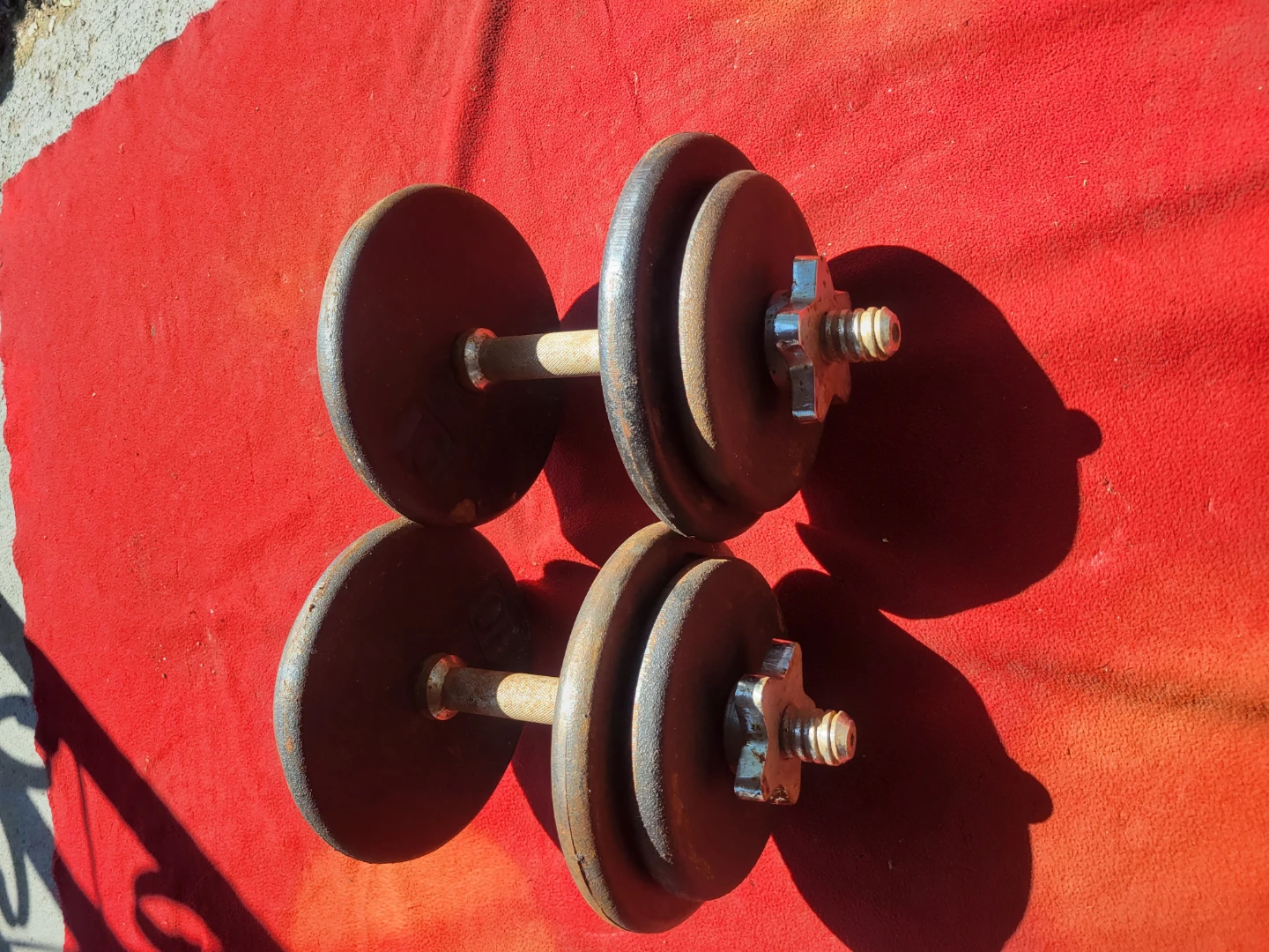 1" HOLE  70LBs WITH DUMBBELL HANDLES.  4-10s  4-7.5s