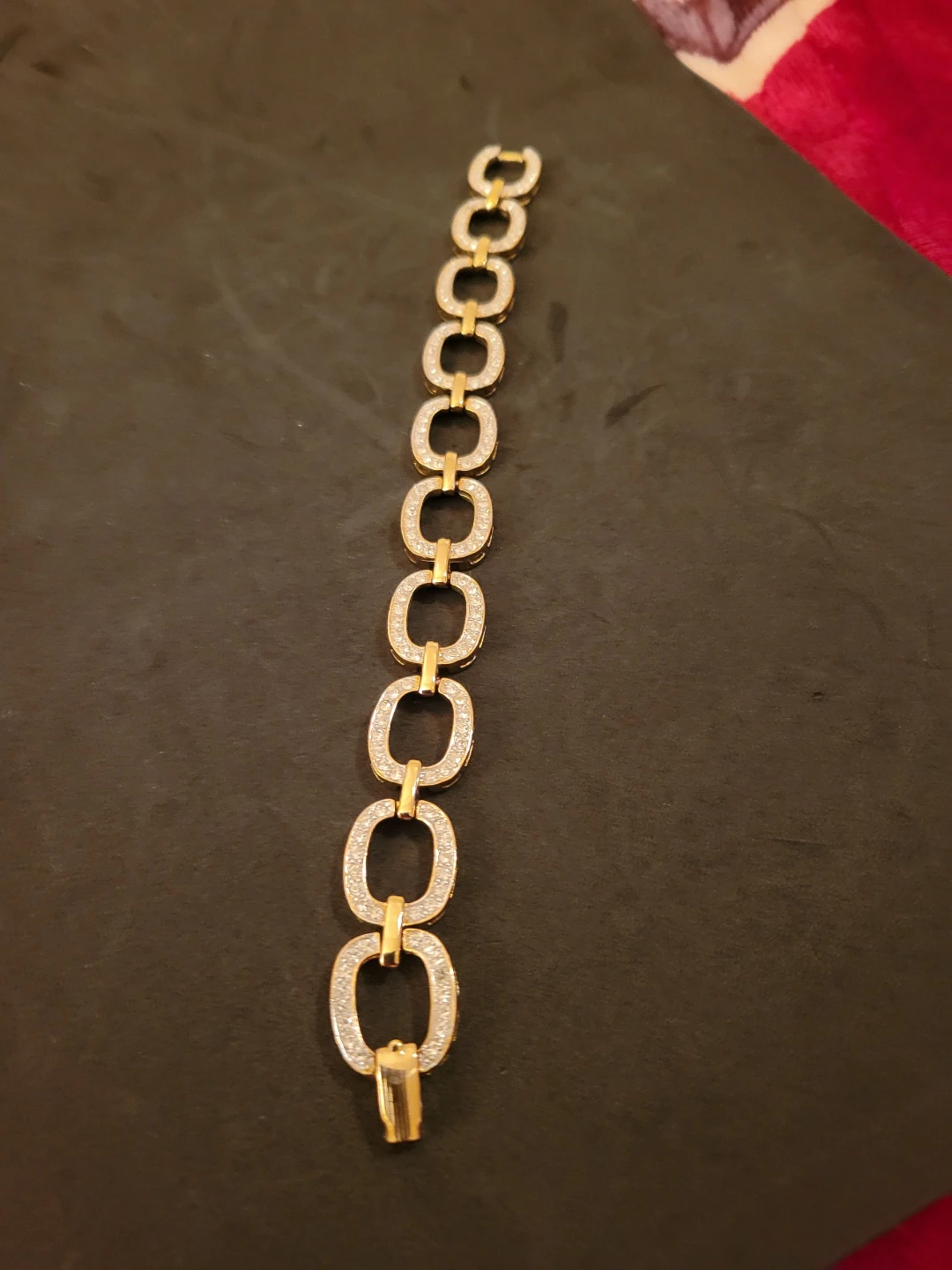 Gold tone link bracelet with rhinestones