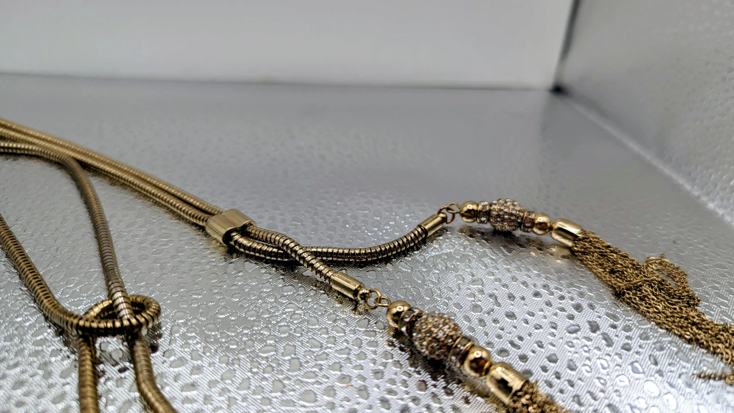 Gold-tone necklace with tassel ends