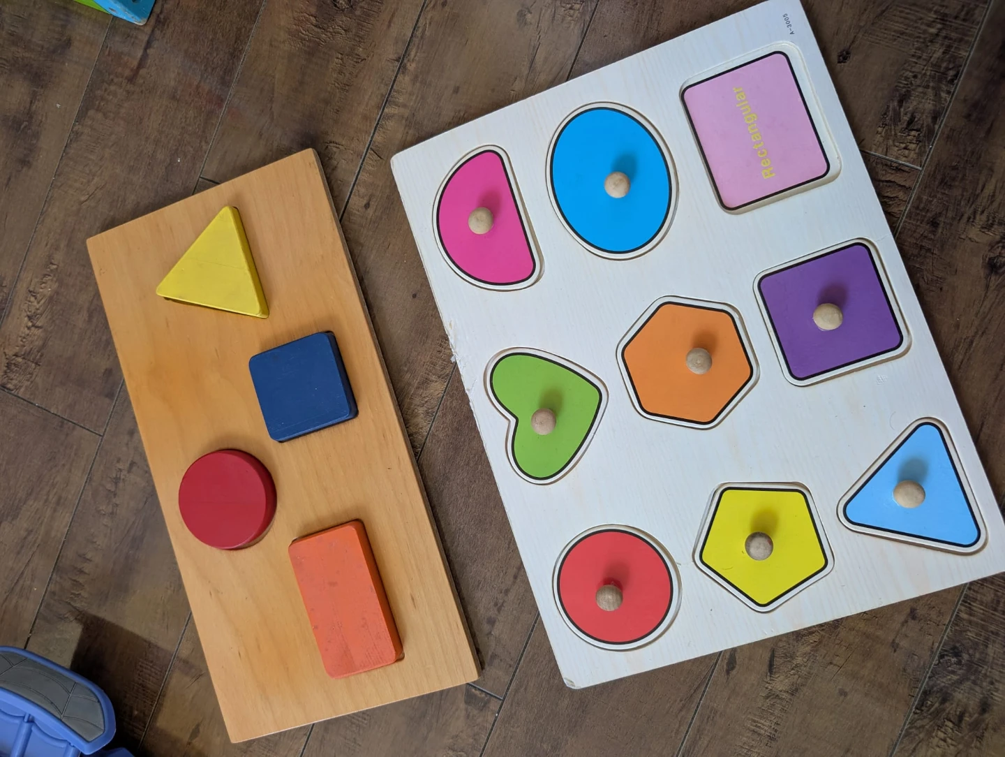 Two wooden peg shape puzzles