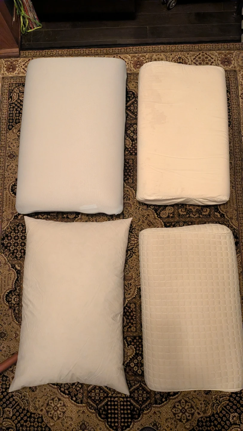 Four assorted pillows, 3 foam, 1 feather