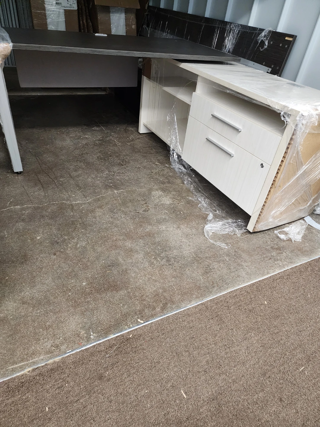 Modern L-shaped desk with drawers and shelves