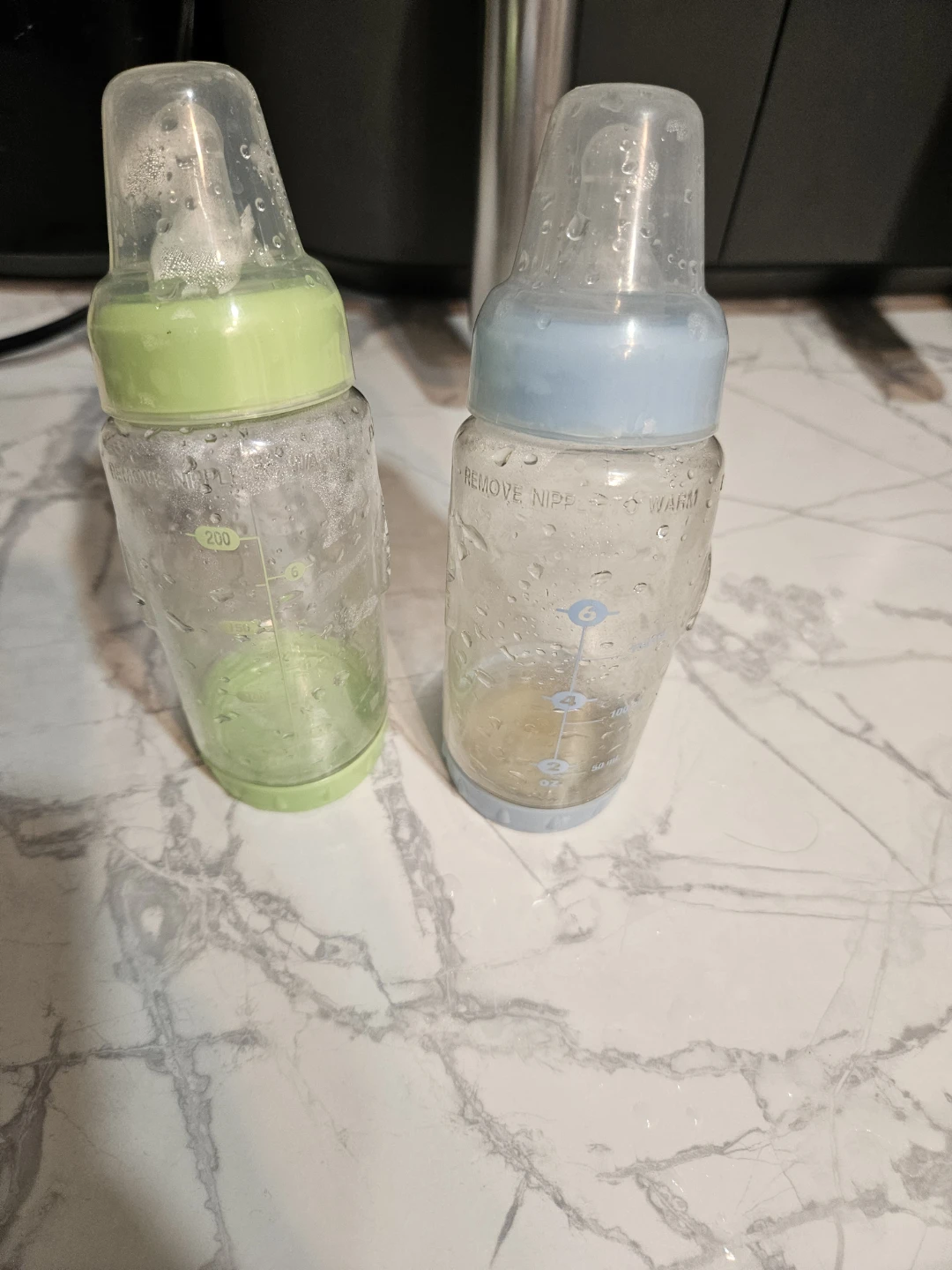 2 Baby Bottles (Green & Blue)