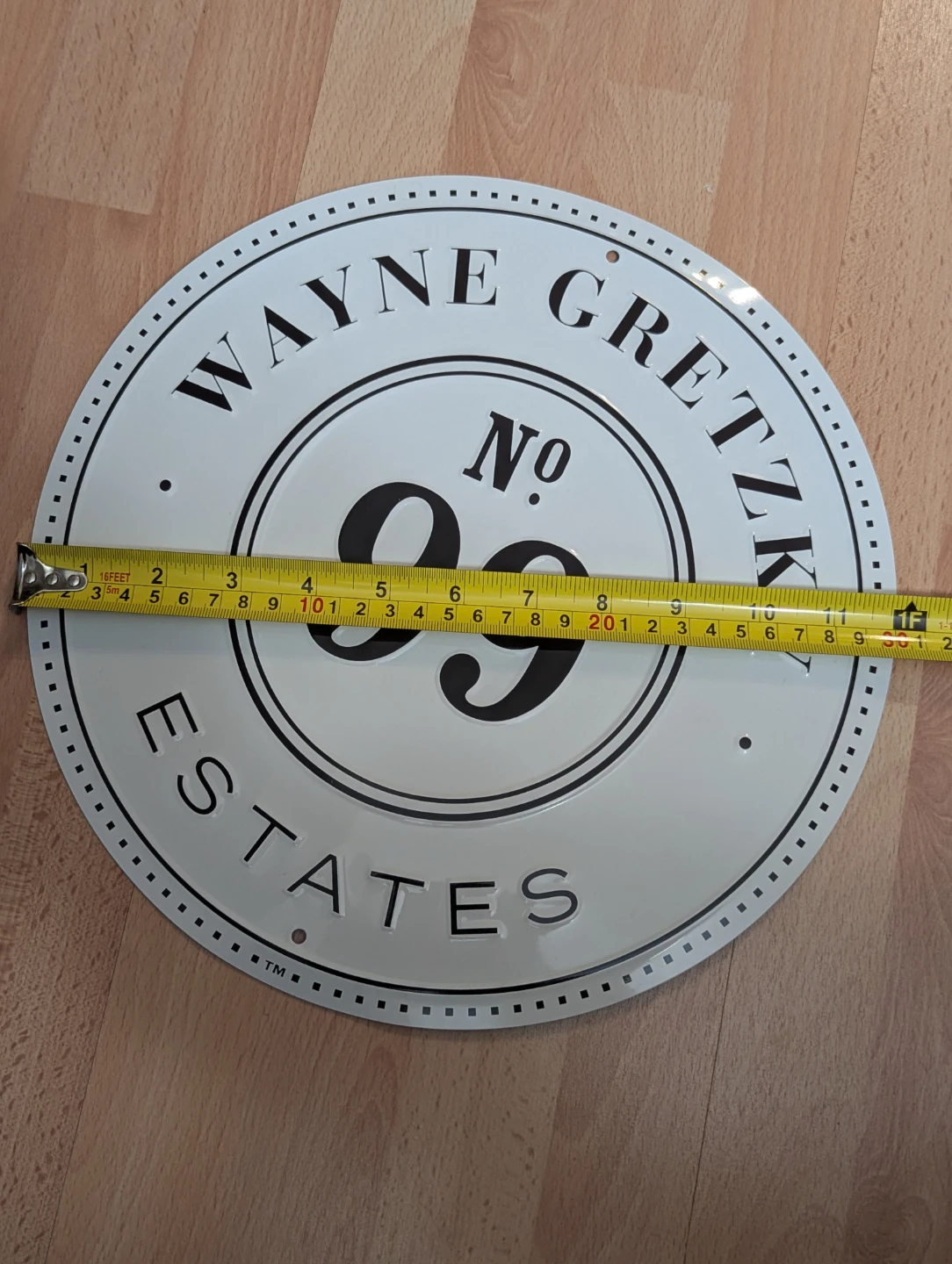 Used thin tin WAYNE GRETZKY No. 99 Estates sign. A little warped