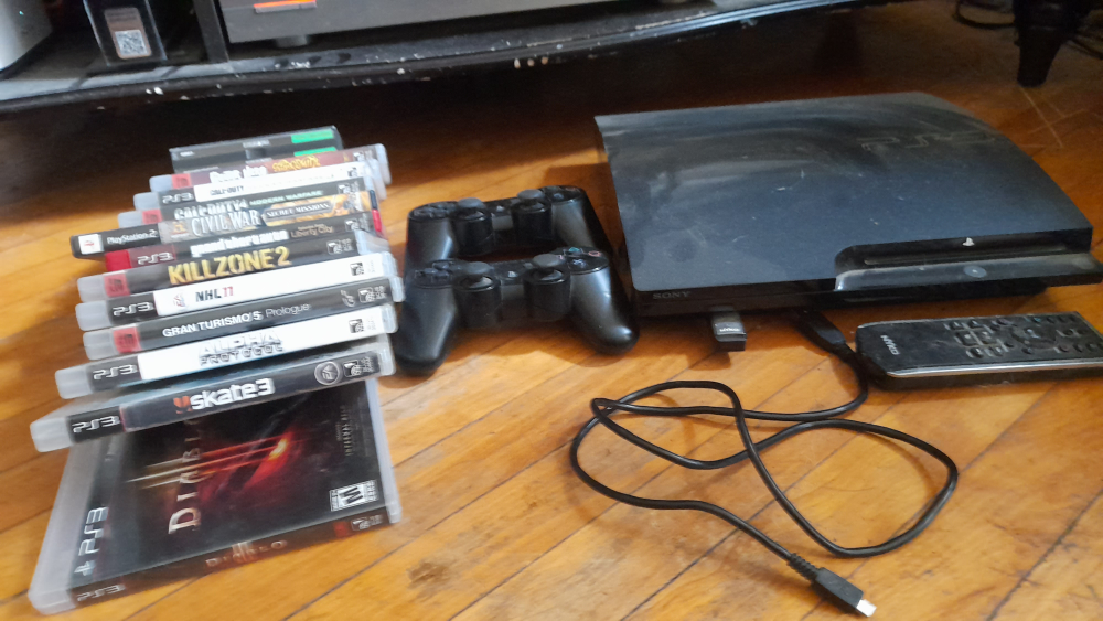 Sony PlayStation 3 Console Bundle with Games and Controllers