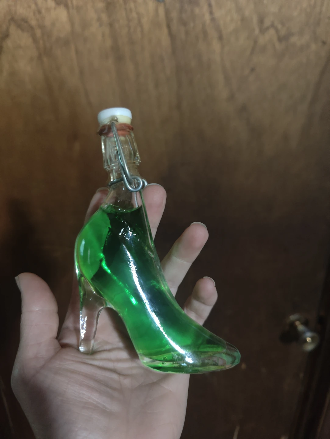 Glass High Heel Shoe Bottle with Green Liquid